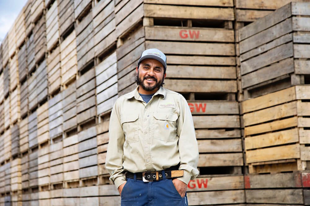 male migrant worker smiling for camera