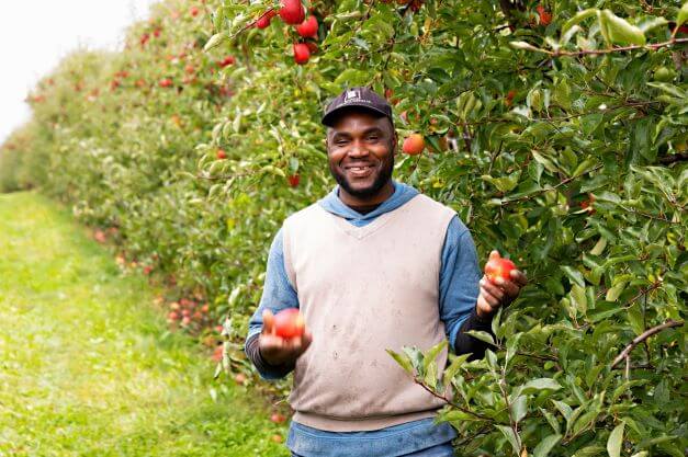 farm employee smiling for camera