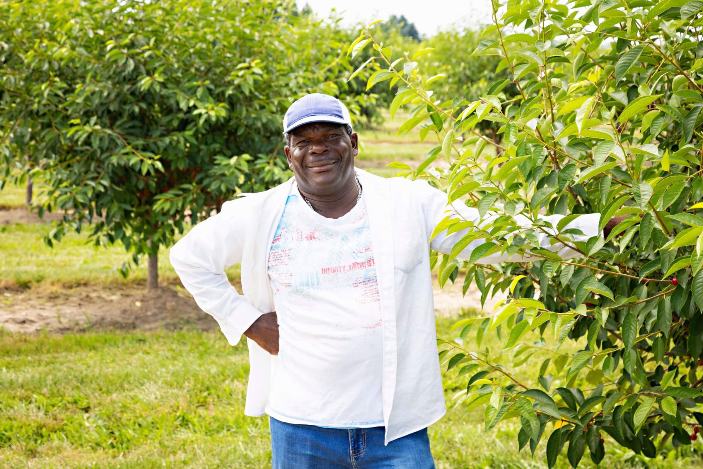 farm worker poses for camera