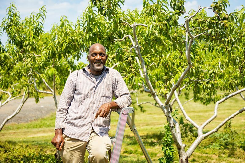 farm worker poses for camera