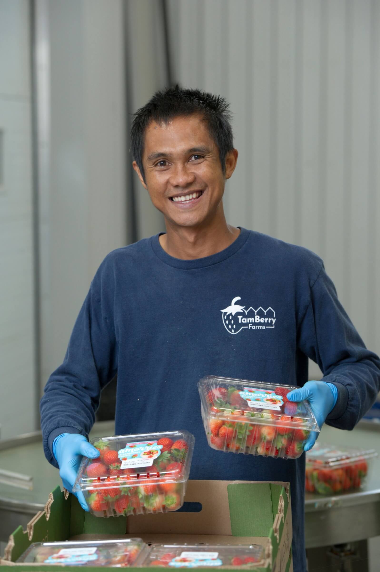 Thai farm worker poses for camera
